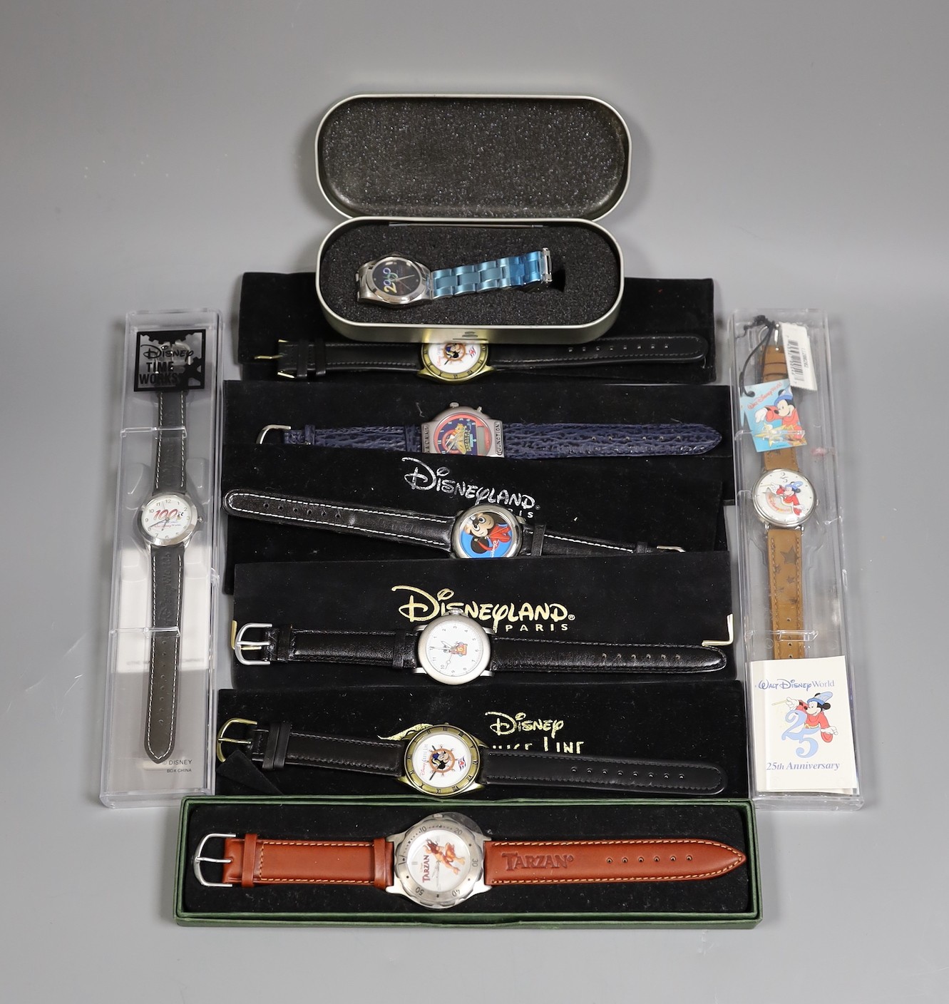 Assorted Walt Disney wristwatches including two commemorative Disney Cruise Line, 100 Years of Magic, Tarzan ride, California Adventure Park, opening of Space Mountain, Disneyland Paris (9 total)